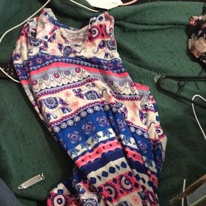 A dress with flowers symbols and elephants